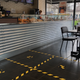A cafe cordones off customers in Milan’s Porta Venezia.